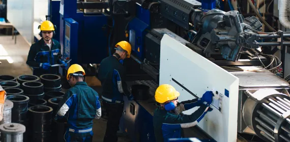 group of workers in a heavy equipment setting