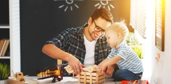 Dad and son playing with blocks