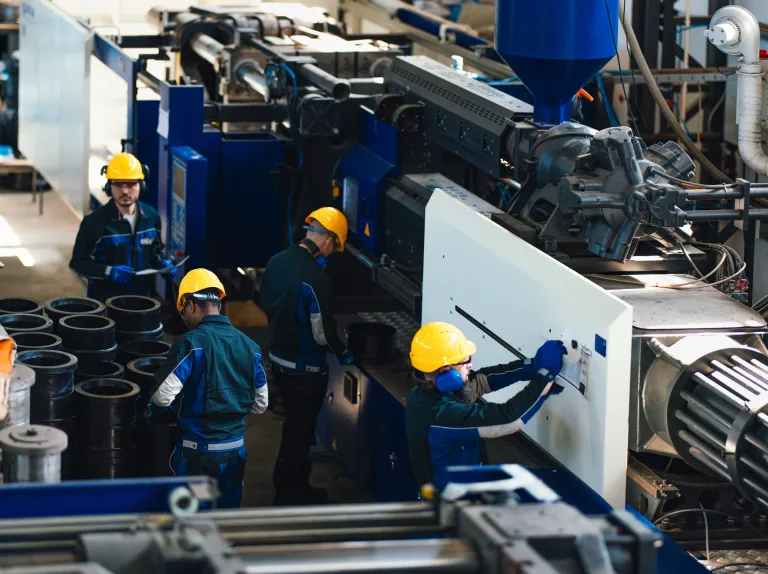 group of workers in a heavy equipment setting